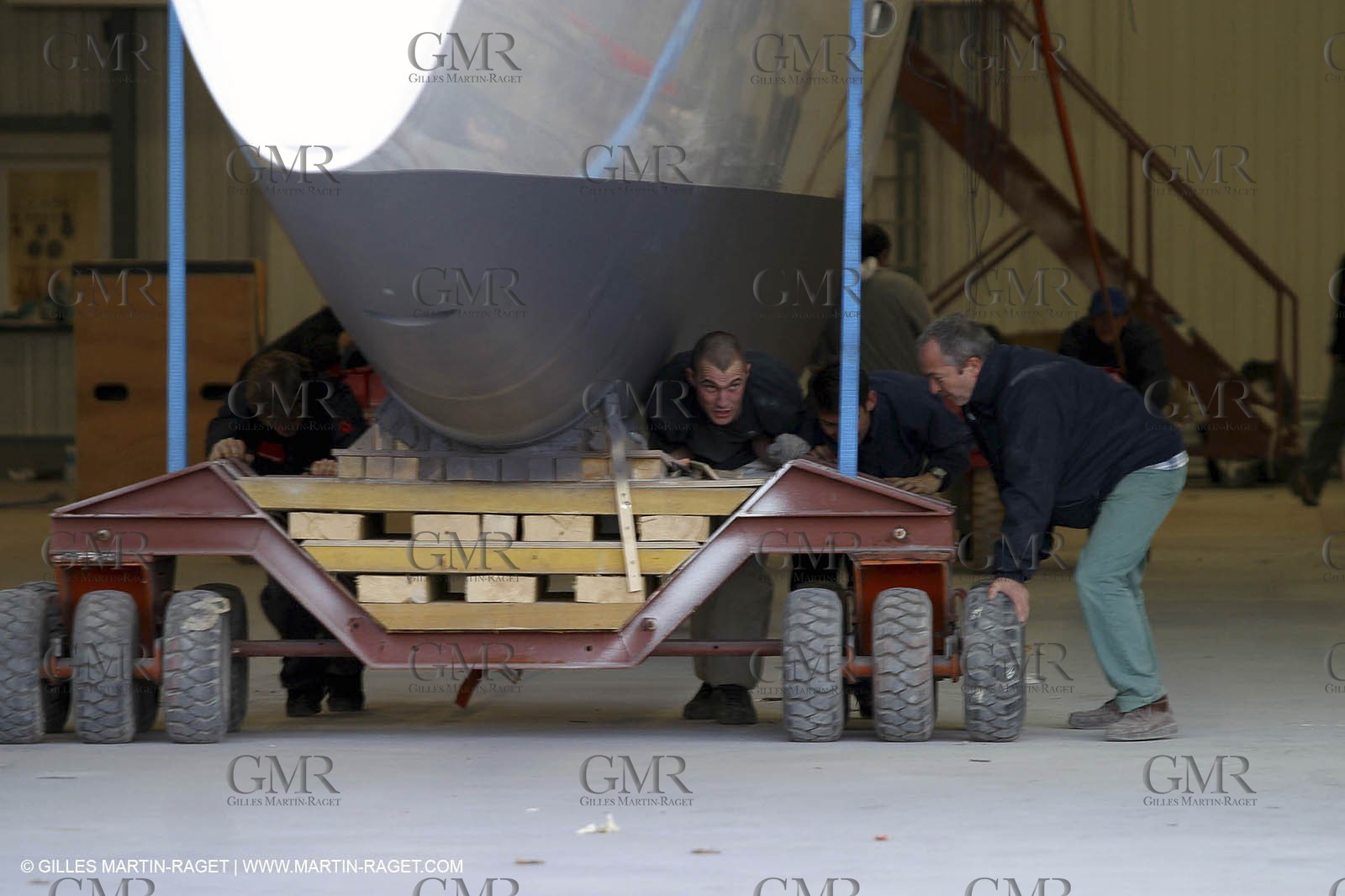 Vannes - Multiplast Boatyard - Orange II going out of the shed
