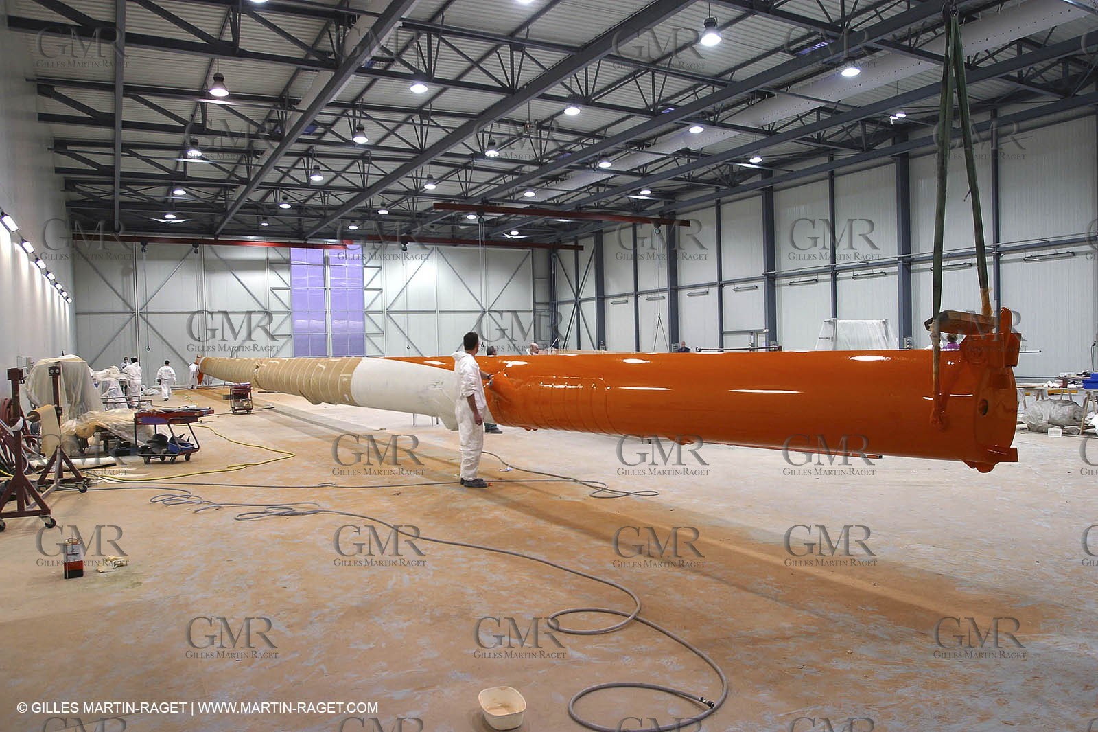 Vannes - Multiplast Boatyard - Orange II going out of the shed